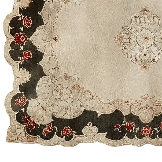 A detailed view of an antique splendor hand-tufted wool area rug featuring intricate floral patterns with bold red and black accents on a cream background.