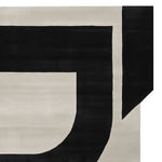 Close-up view of the Architectural Mood Canvas Hand Tufted Rug, featuring a bold black and cream geometric pattern. This contemporary area rug is perfect for adding a modern touch to your living room. Ideal for those seeking stylish area rugs for living room spaces, this 8x10 wool rug combines durability with a chic design.