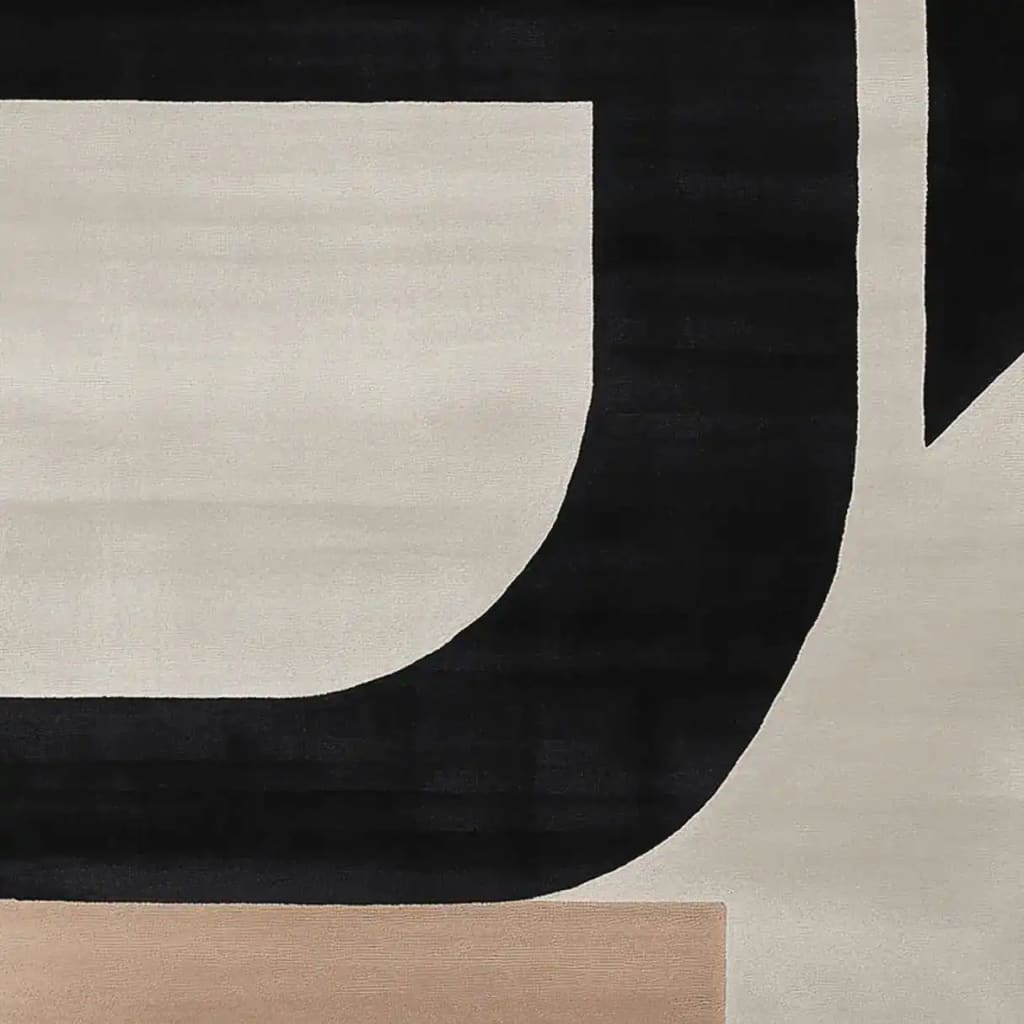 Close-up view of the Architectural Mood Canvas Hand Tufted Rug, showcasing its contemporary design with bold black and beige geometric patterns. This wool area rug is perfect for adding a modern touch to any living room, especially in an 8x10 size.