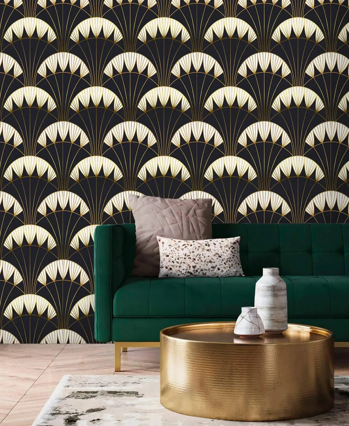 Art Deco black gold wallpaper behind green velvet sofa and gold round coffee table, repeating cream fan scallop pattern