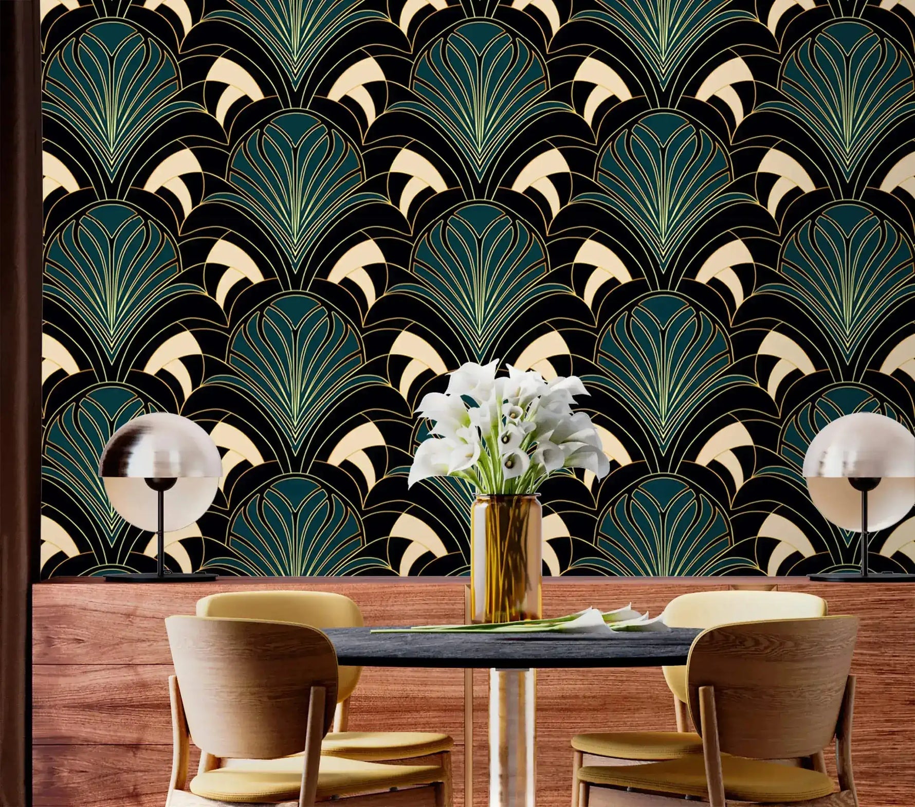 Art deco greenery fan-leaf wallpaper behind dark dining table with wood sideboard and white flower vase