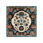 Top view of the Artesian Splendor Knotted Wool Area Rug featuring intricate floral patterns with vibrant red, orange, and green colors on a dark background, surrounded by a detailed border design.