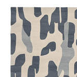 Top view of the Ash Flow Rhythm Hand Tufted Rug, showcasing its contemporary design with abstract patterns in shades of gray and cream. This 8x10 area rug is crafted from wool, making it a stylish addition to any living room.