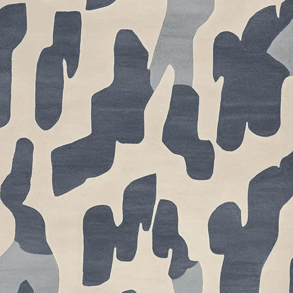 A contemporary hand-tufted area rug featuring an abstract design with shades of blue and cream. This wool rug is perfect for adding a modern touch to living room spaces, available in the popular 8x10 size.