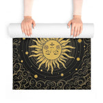 Astral Balance yoga mat unrolled, central gold radiant sun-face medallion with stars and clouds
