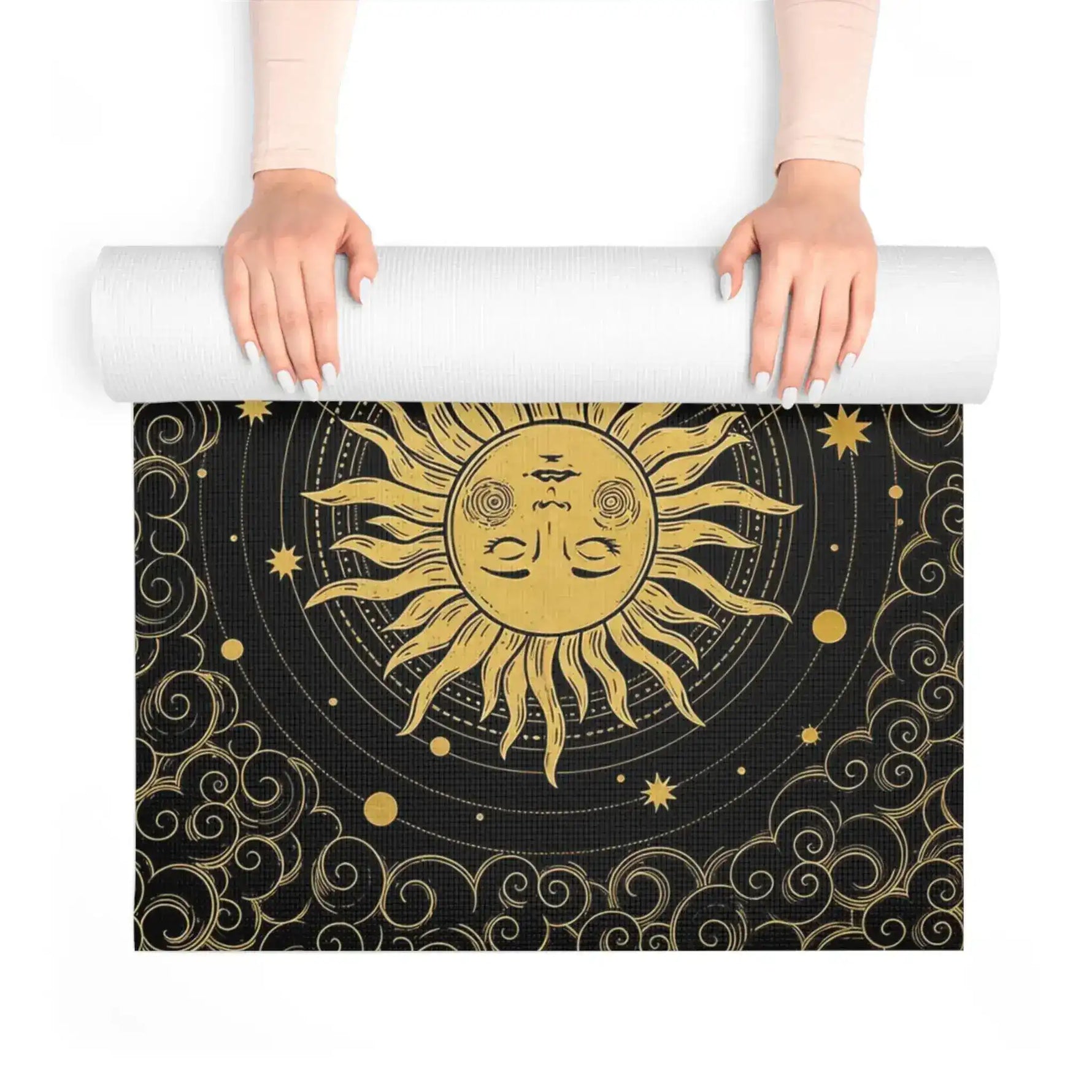 Astral Balance yoga mat unrolled, central gold radiant sun-face medallion with stars and clouds