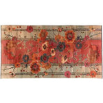 Top view of an area rug titled 'Autumn's Embrace Knotted Wool Rug' featuring a vibrant floral pattern with rich orange and red hues, accented by intricate botanical designs. This elegant wool rug adds a warm, artistic touch to any room decor.