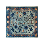 Beautiful Azure Eternal Knotted Wool Area Rug with intricate floral patterns in rich blue tones, featuring vibrant blossoms and delicate vines, perfect for adding elegance to any room.
