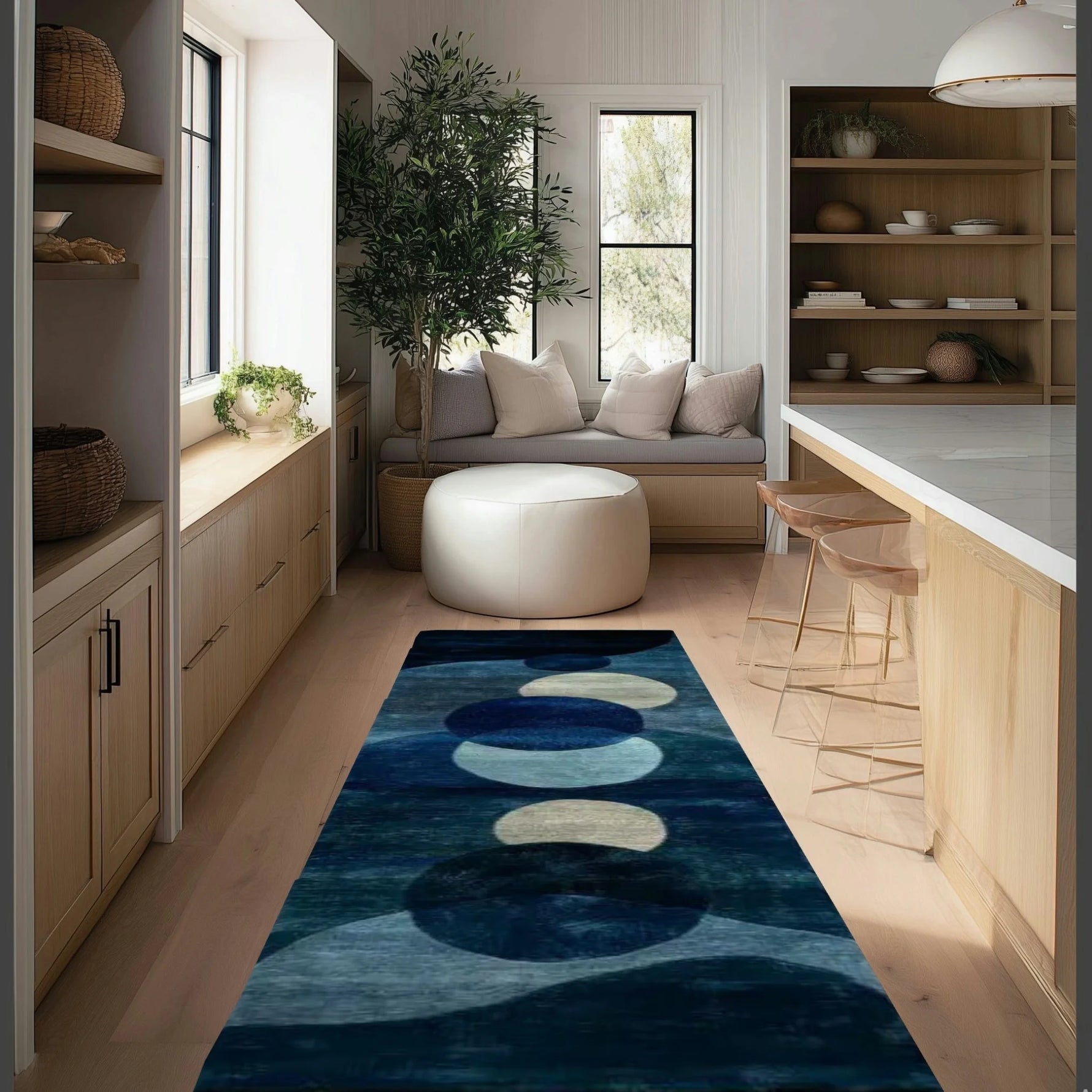Deep blue wool runner with abstract circular orbs in cream and azure, in a light-wood kitchen with a window seat