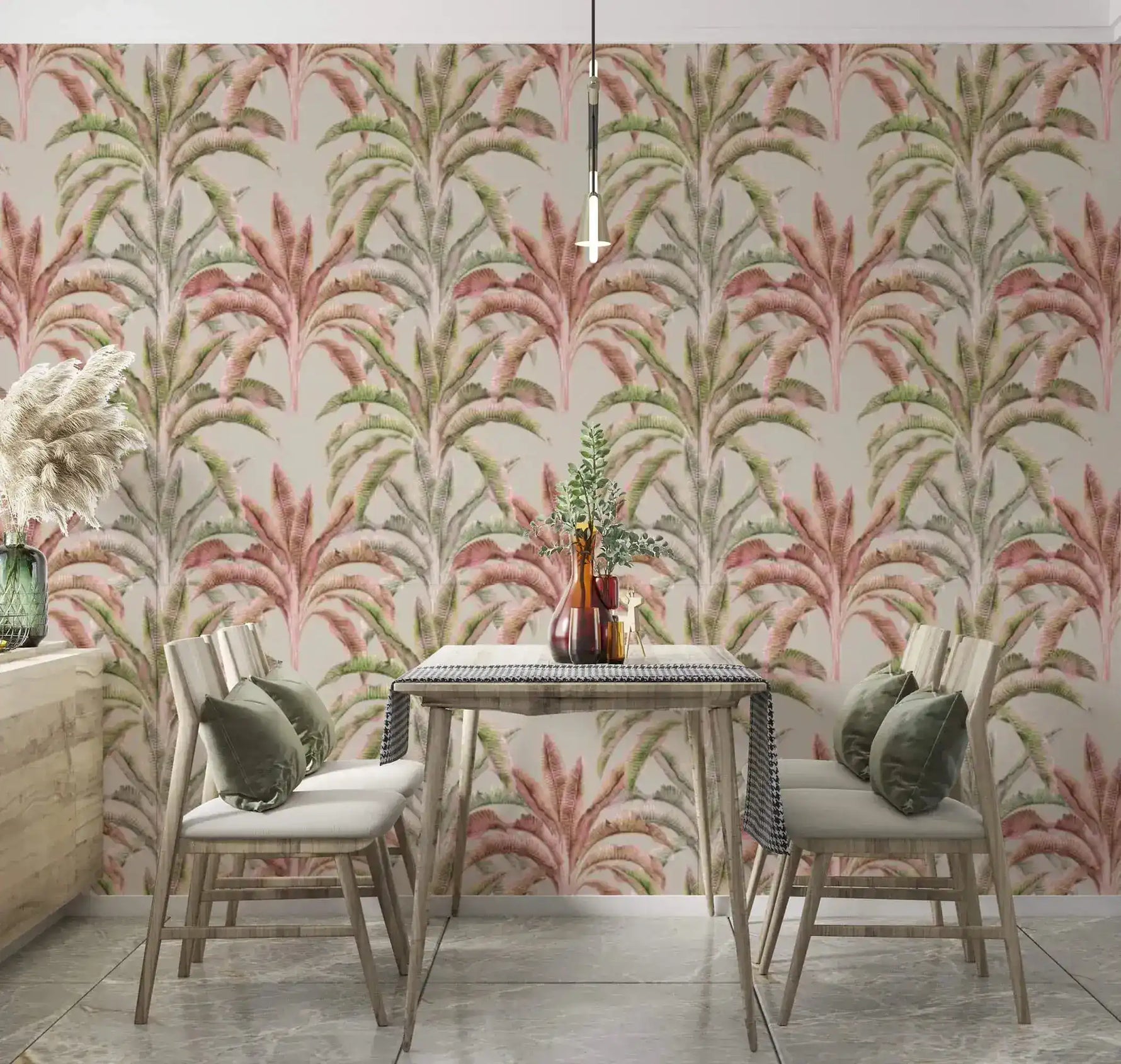 Banana grove wallpaper in pink and green behind a wood dining table with chairs and pendant light