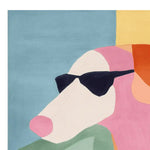 A vibrant, hand-tufted area rug featuring an abstract design of a dog wearing sunglasses. This contemporary wool rug showcases bold colors like blue, pink, and orange, perfect for adding a playful touch to living room area rugs. Ideal for those seeking a unique square area rug for their space.