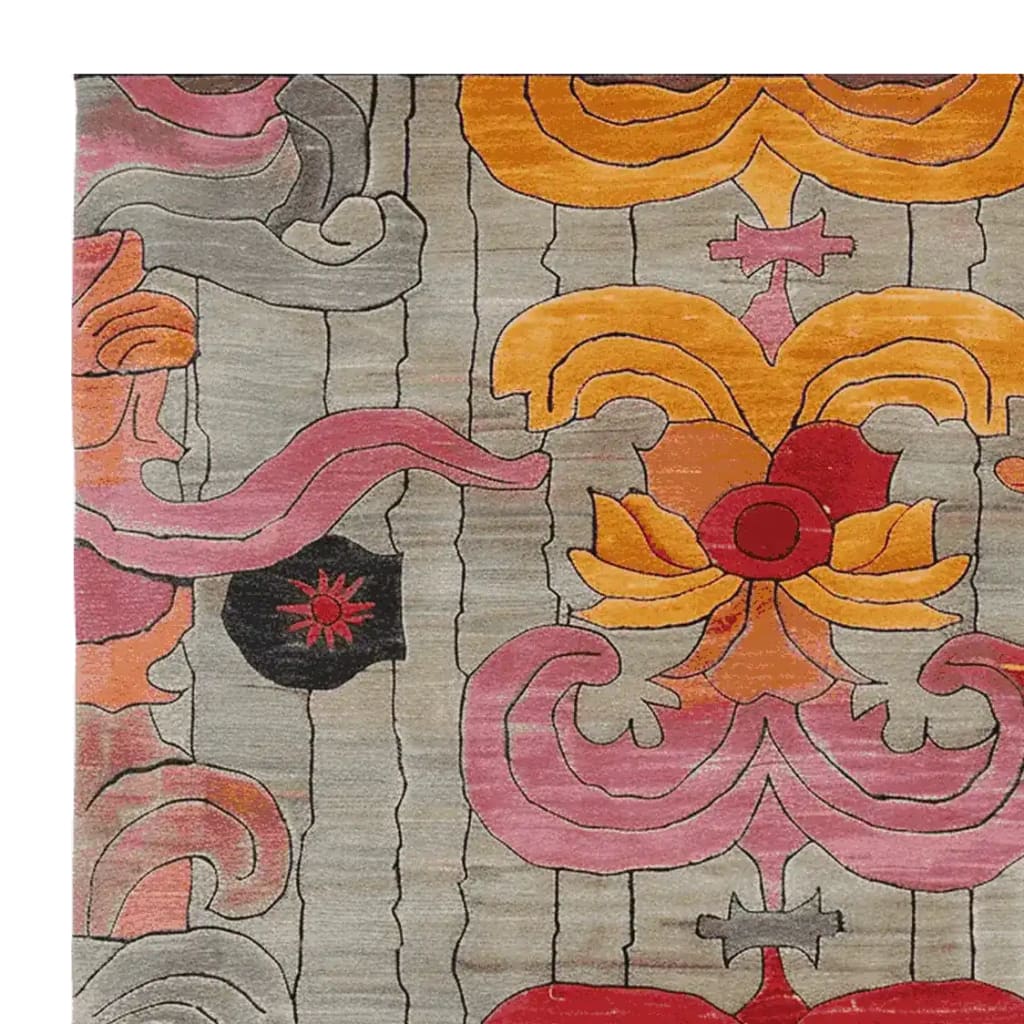Close-up view of the Baroque Fire Bloom Hand Tufted Area Rug showcasing its intricate floral patterns in vibrant shades of orange, pink, and red against a neutral background. This detailed design adds a touch of elegance and warmth to any room.