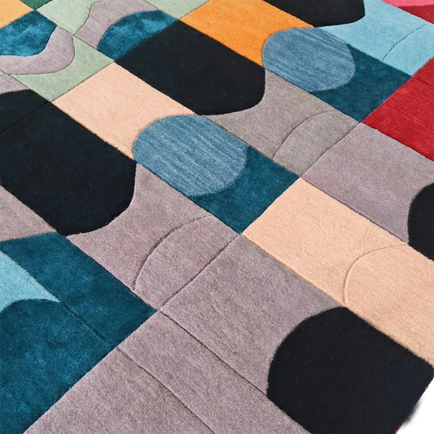Colorful geometric-patterned rug with various shapes and colors.