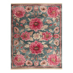 Beautiful Blossom Medley Hand Tufted Area Rug featuring vibrant pink floral patterns on a teal background. This large wool rug is perfect for adding elegance to your living room or dining room, creating a warm and inviting atmosphere.
