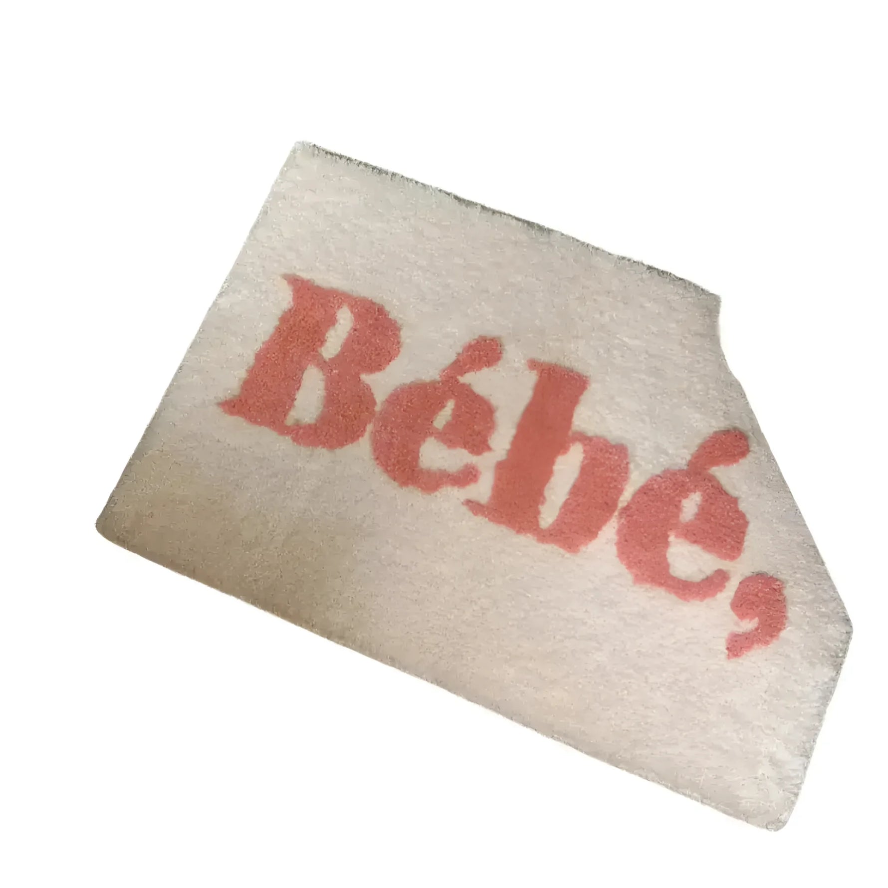 A stylish Bebe bathroom area rug featuring bold pink text on a soft, cream background. The asymmetrical design adds a modern touch, perfect for enhancing any bathroom decor.