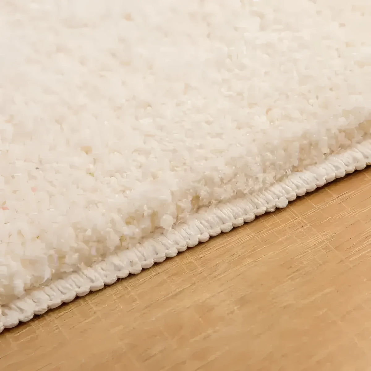 Close-up view of the Bebe Bathroom Mat showcasing its plush, textured surface and sturdy stitching, ideal as an area rug for enhancing bathroom decor.
