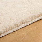 Close-up view of the Bebe Bathroom Mat showcasing its plush, textured surface and sturdy stitching, ideal as an area rug for enhancing bathroom decor.