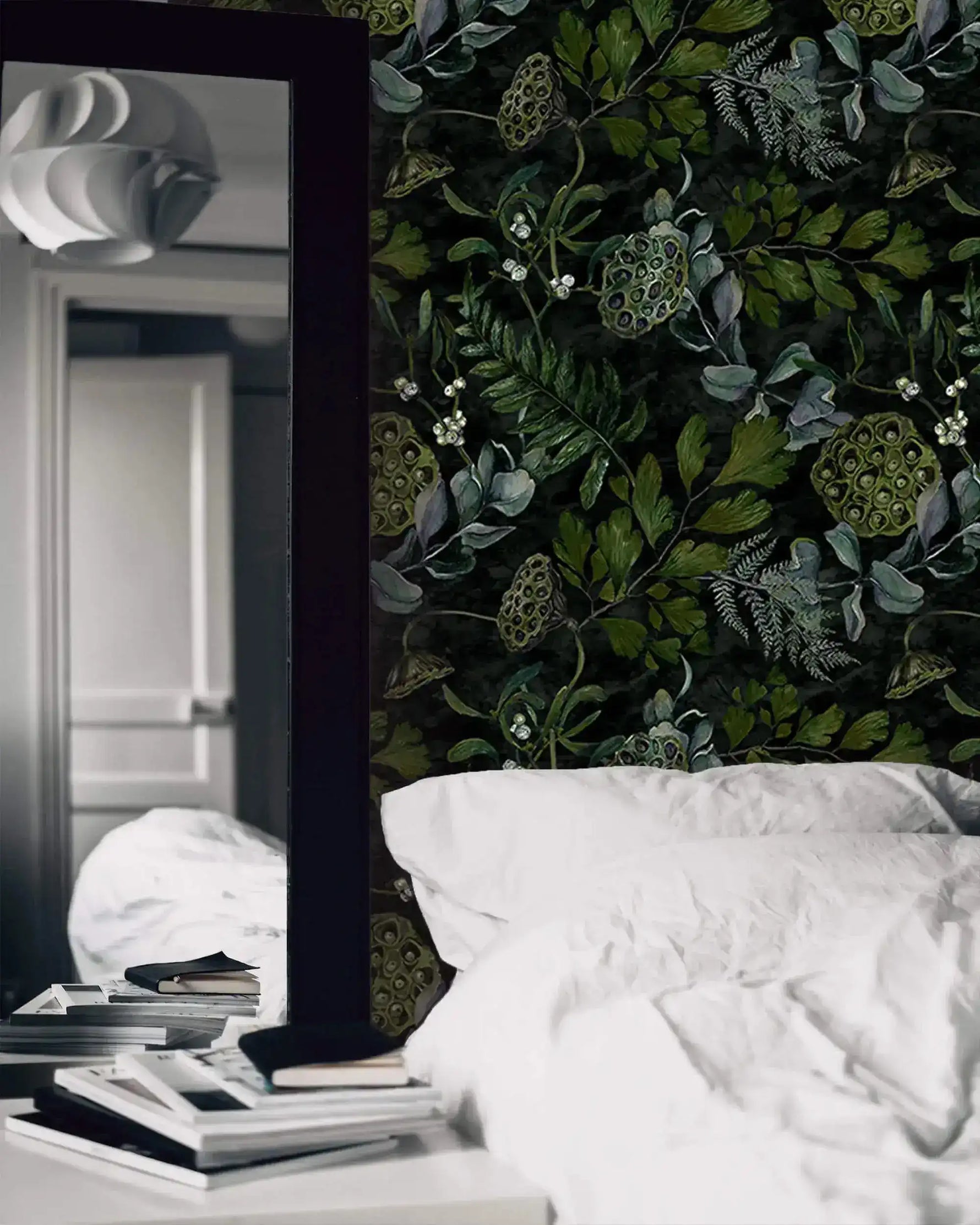 Bedroom mirror and white bedding beside enigmatic leafy canopy wallpaper with green pods