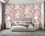 Bedroom with grey bed and globe pendants against pink tropic breeze frond wallpaper
