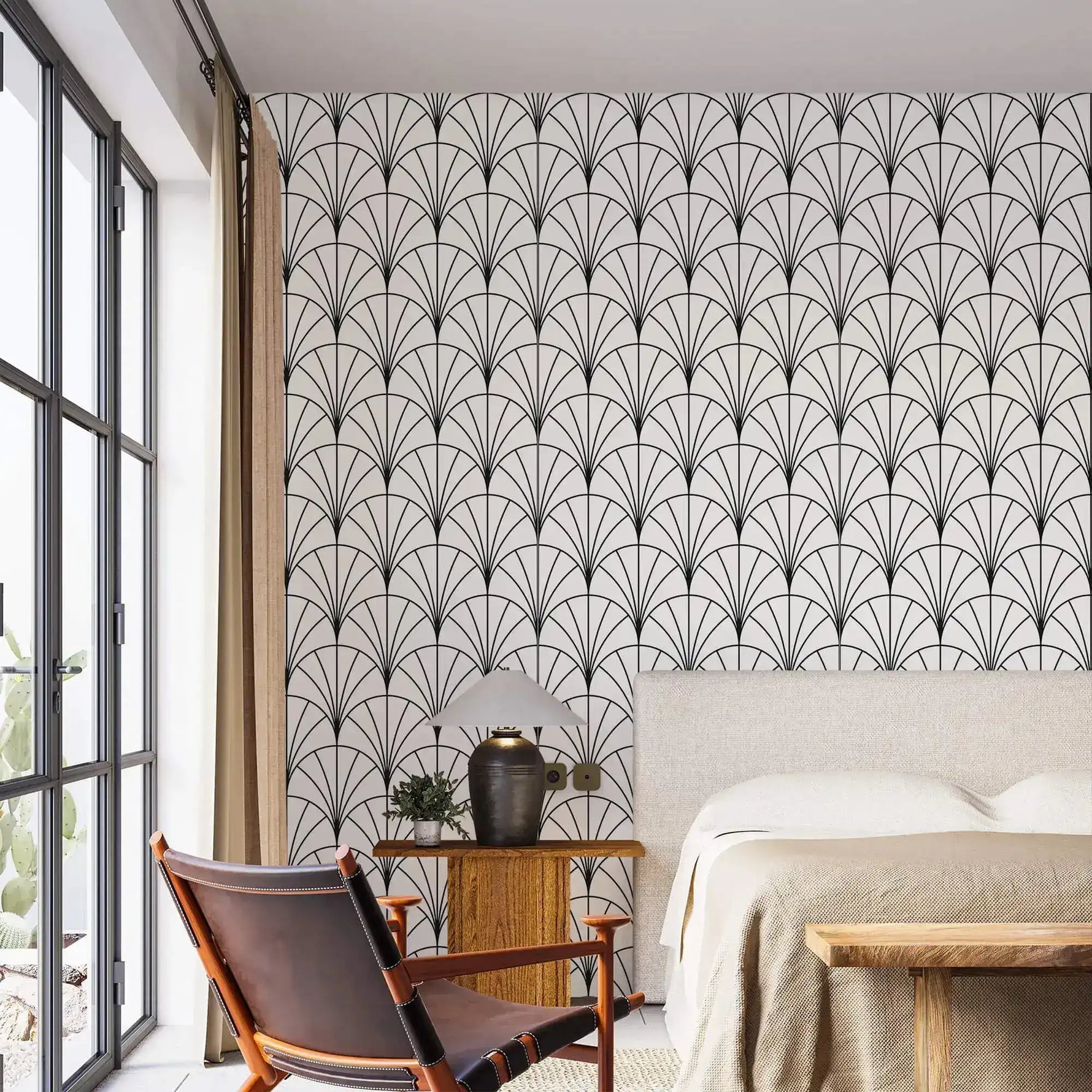 Bedroom with upholstered bed and leather chair against monochrome round line fan wallpaper
