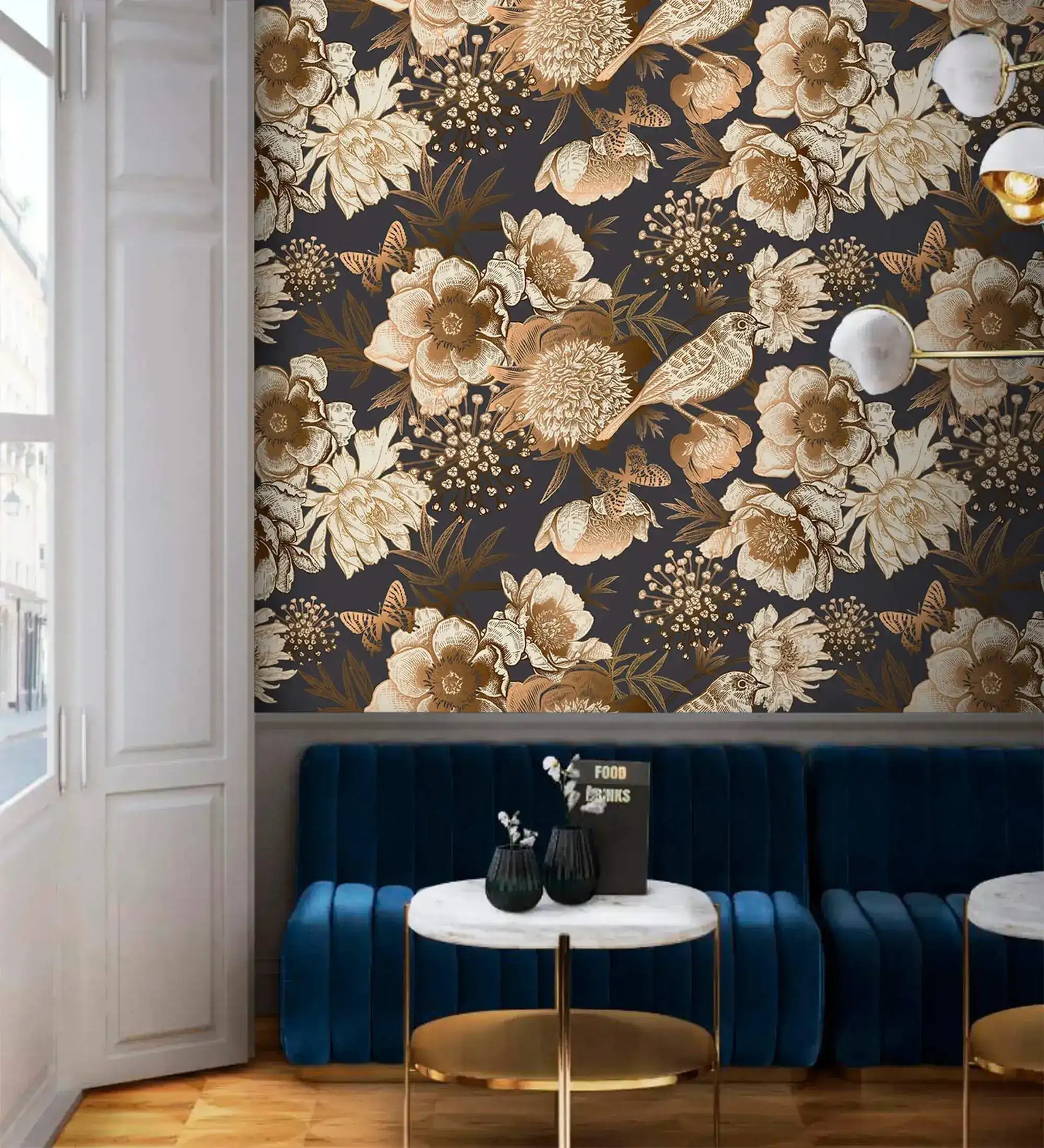 Bird garden wallpaper above blue velvet banquette, golden blooms and birds patterned on dark navy