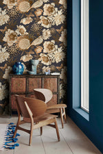 Bird garden wallpaper beside window with carved cabinet, sepia peonies and birds on deep navy ground