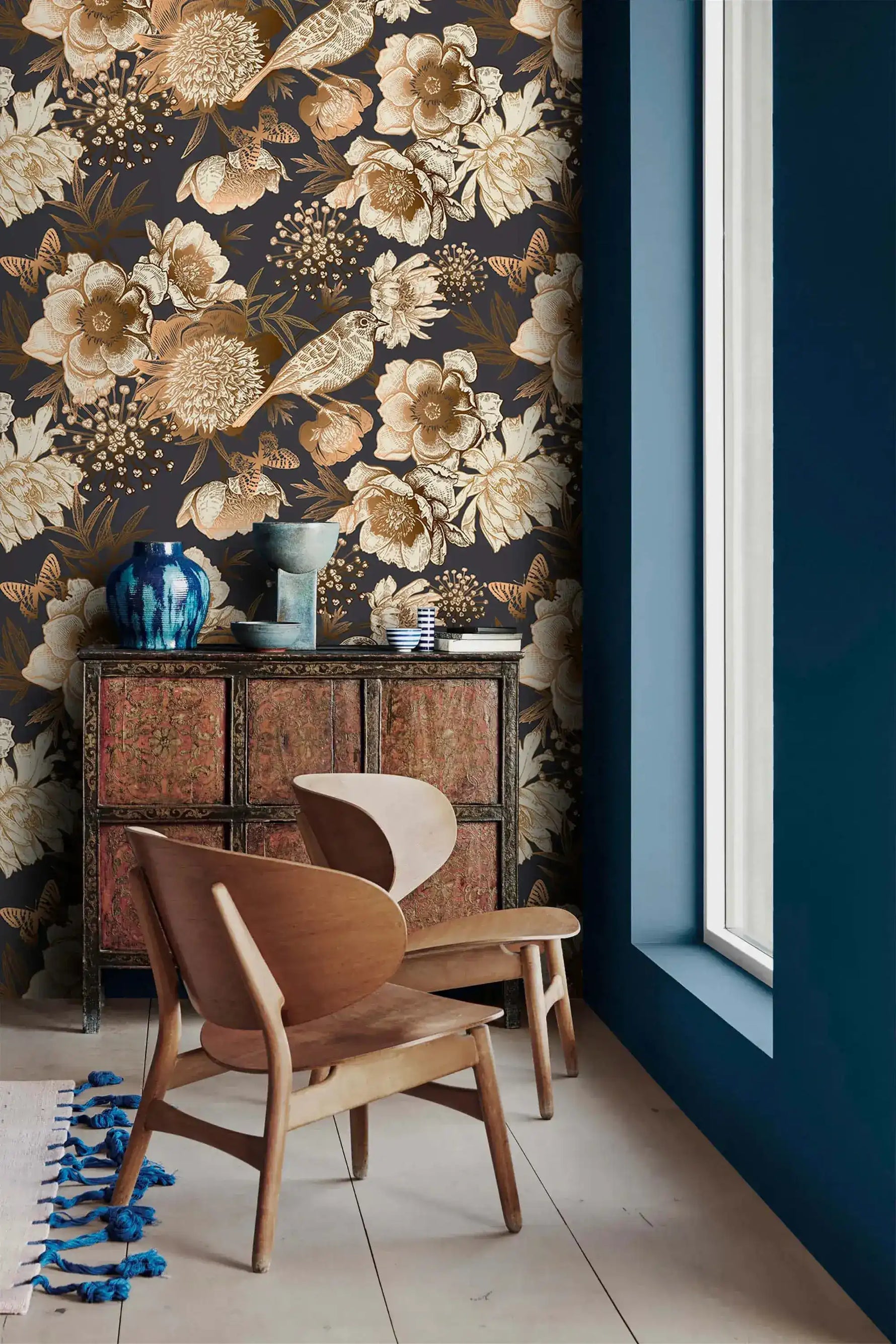 Bird garden wallpaper beside window with carved cabinet, sepia peonies and birds on deep navy ground