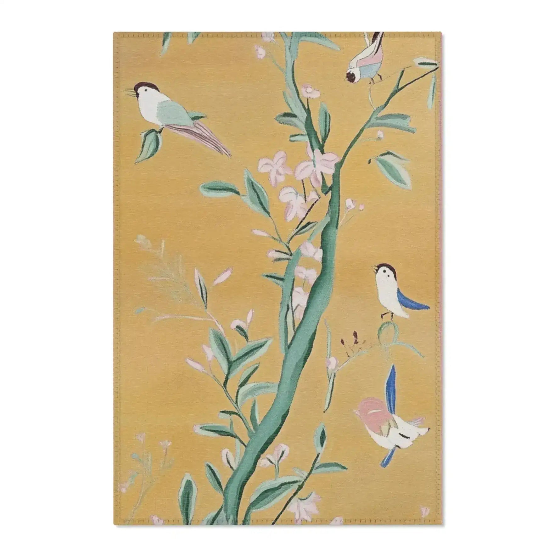 Golden yellow Birds and Blossoms Accent Rug with chinoiserie birds on flowering branches, stitched edge detail visible on flat lay