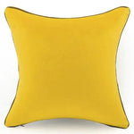 Golden yellow throw pillow cover with a smooth texture, perfect for adding a pop of color to any living space.