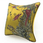 Golden jacquard throw pillow cover featuring vibrant birds and lush foliage, perfect for adding a touch of wilderness to your home decor.