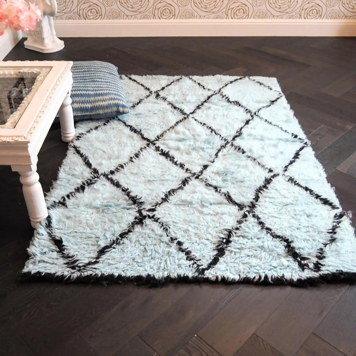 A stylish Black and Blue Diamonds Shag Wool Rug placed in a modern living room. The area rug features a soft and plush texture with a striking diamond pattern, ideal for contemporary living room area rugs. Perfect for adding warmth and style to any living space.