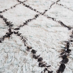 Close-up of a Black and Blue Diamonds Shag Wool Rug, showcasing its intricate diamond pattern and luxurious texture. Perfect for adding a cozy touch to your living room area. Ideal for those seeking stylish living room area rugs and quality wool rugs.