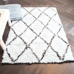 Top view of a Black and Blue Diamonds Shag Wool Rug, showcasing its plush texture and geometric pattern, perfect for enhancing the comfort and style of any living room area. Ideal as a wool rug or a centerpiece for living room area rugs.