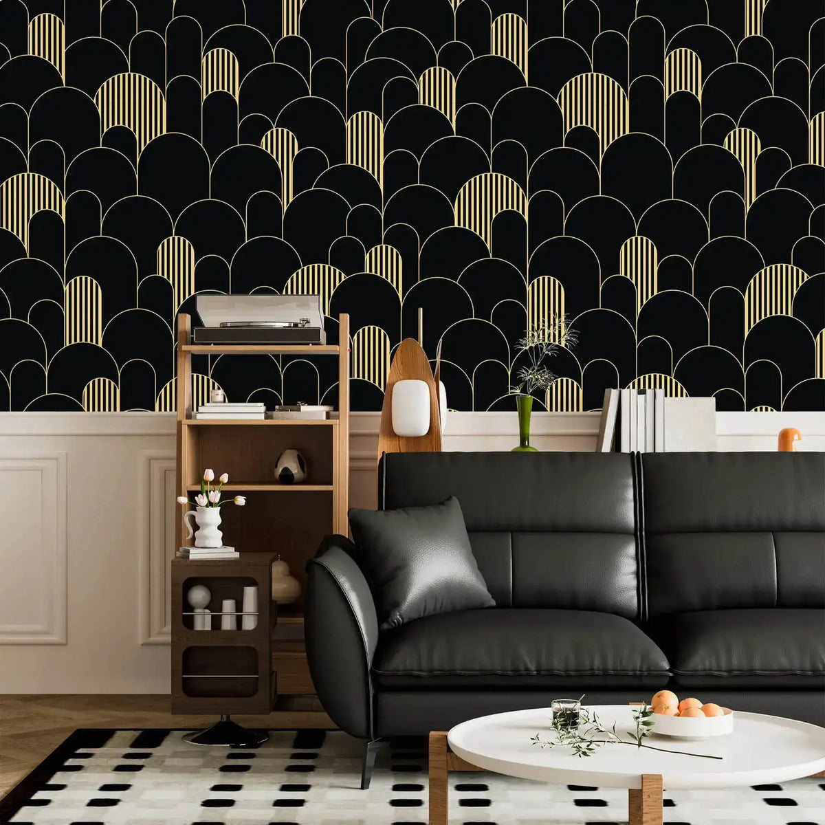 Black and gold art deco arch wallpaper above wainscoting with a black leather sofa and shelf unit