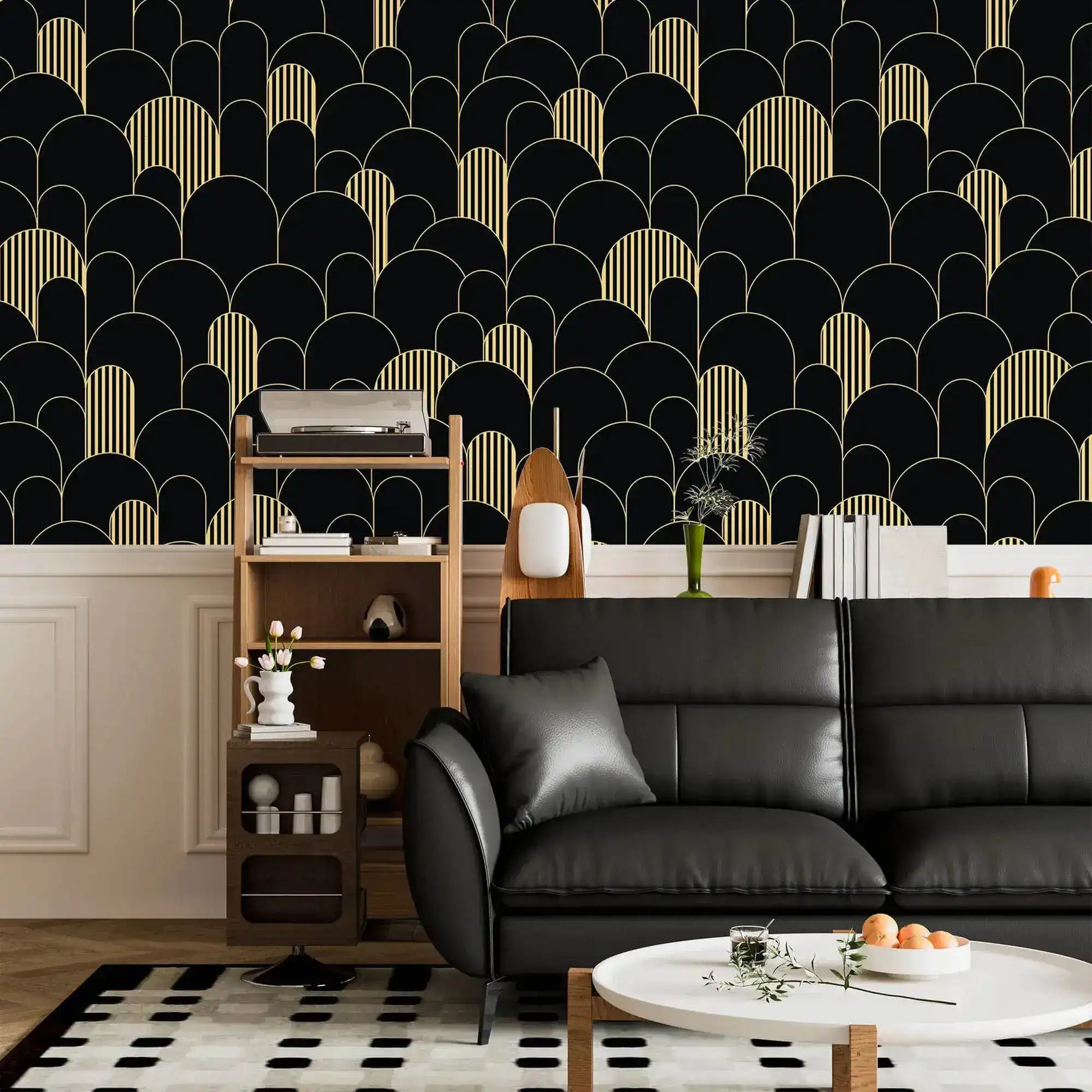 Black and gold art deco arch wallpaper above wainscoting with a black leather sofa and shelf unit