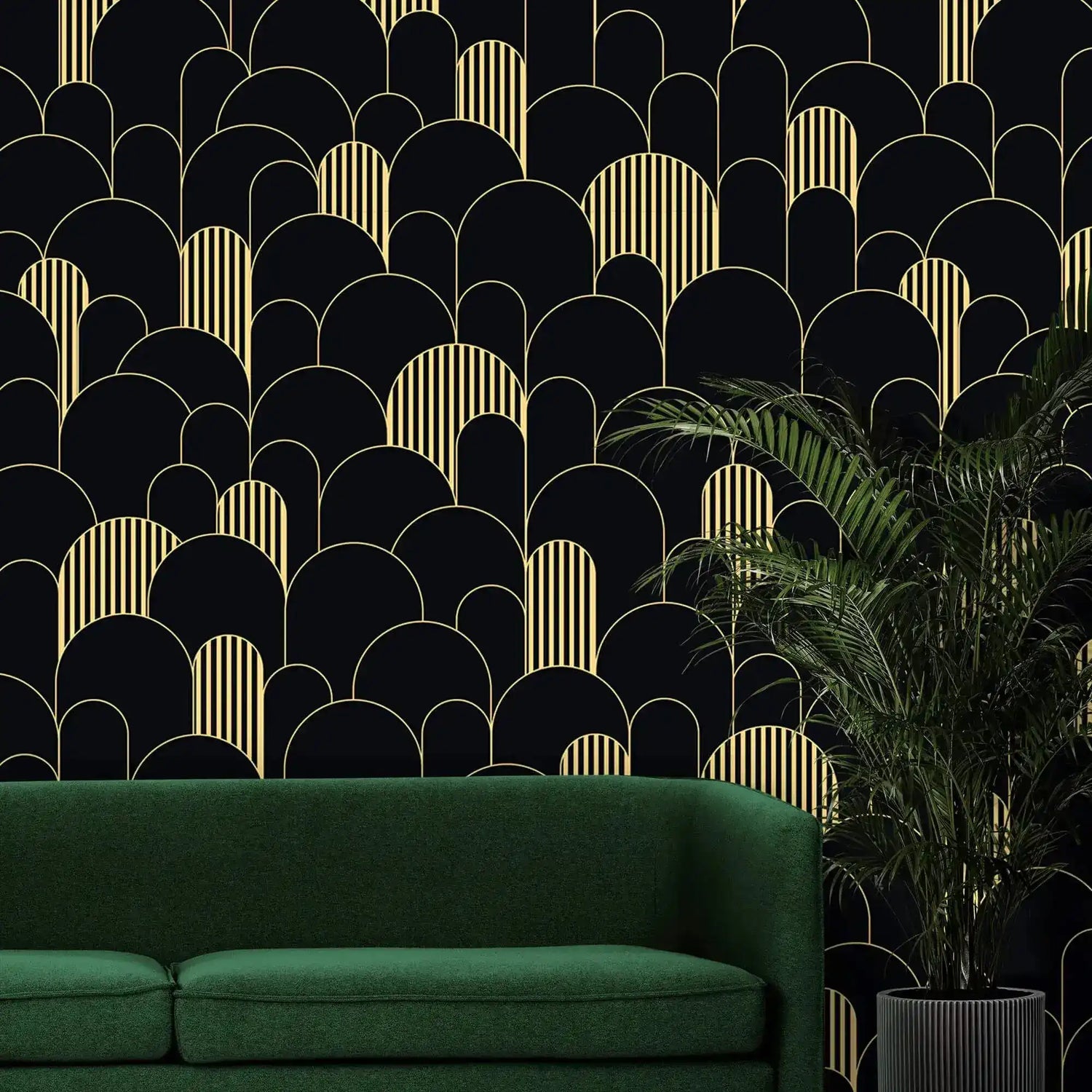 Black and gold art deco arch wallpaper behind an emerald sofa with a potted palm