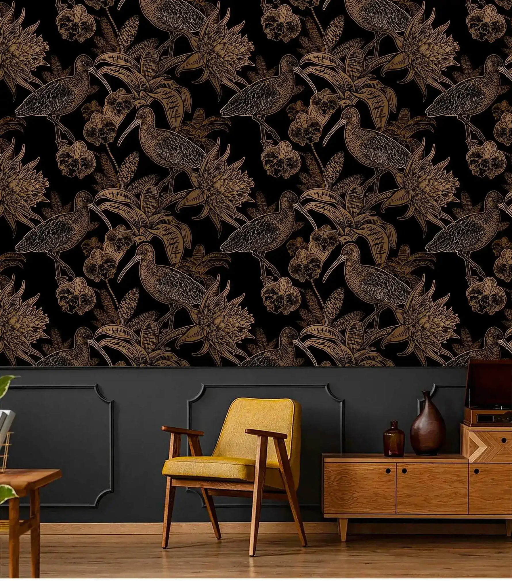 Black and gold line-art bird wallpaper above charcoal panelling with yellow chair and wood sideboard