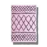 A luxurious Black and Pink Diamonds Shaggy Wool Area Rug, perfect for adding style to your home. This runner rug features a striking pattern of black diamond shapes on a soft pink background, ideal for use as a bathroom runner rug, kitchen rug, wool rug, or hallway runner rug. Its plush texture offers comfort and elegance, making it a fantastic choice for kitchen runner rugs.