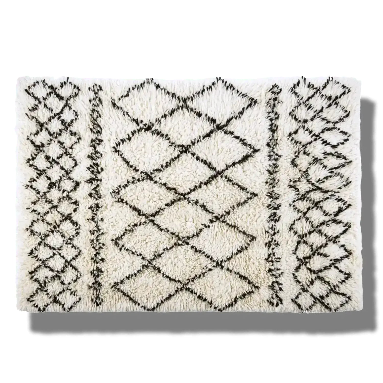 Top view of a Black and White Diamonds Shaggy Wool Area Rug, perfect as a runner rug for bathrooms, kitchens, or hallways. The rug features a striking black geometric diamond pattern on a white shaggy wool texture, adding a touch of elegance to any space.