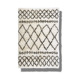Top view of a Black and White Diamonds Shaggy Wool Area Rug, perfect as a runner rug for hallways or kitchens. This wool rug features an intricate diamond pattern, making it a stylish addition to any bathroom or kitchen setting.