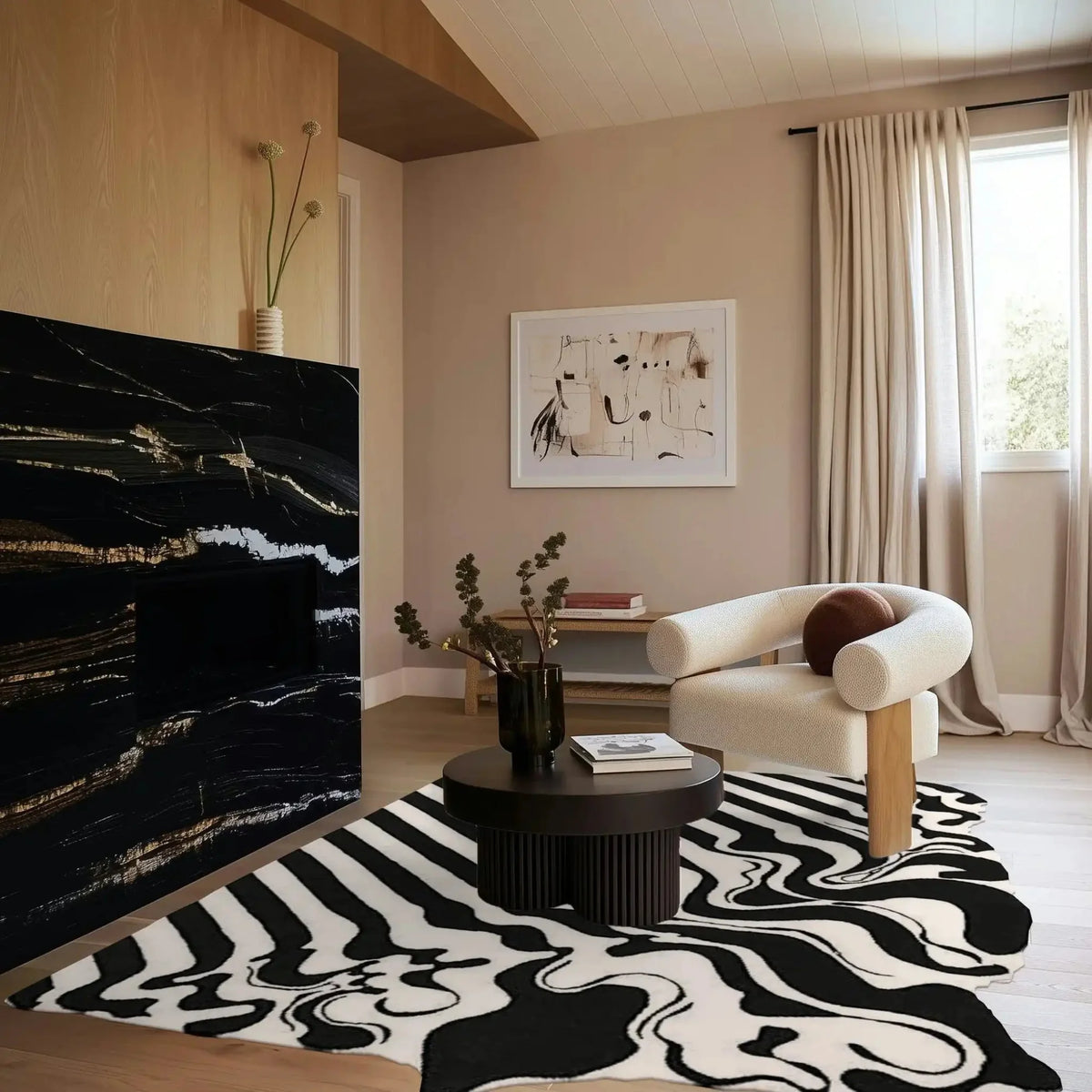 A stylish black and white melting hand-tufted wool area rug enhances a modern living room setting. The large living room rug features an abstract pattern, complementing a cozy, neutral-toned space with a sleek black coffee table and a comfortable armchair. Perfect for both offices and living rooms, this rug adds a touch of elegance and warmth.