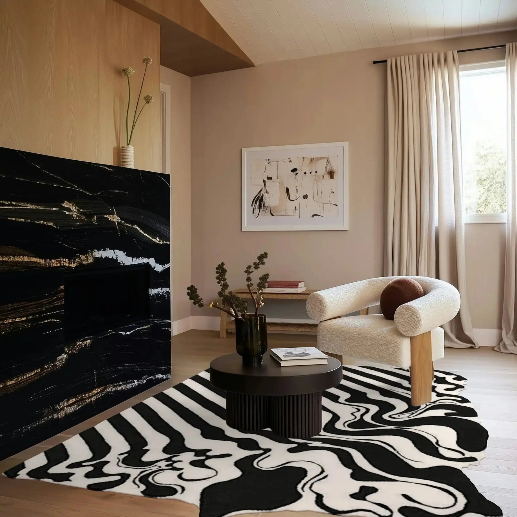 A stylish black and white melting hand-tufted wool area rug enhances a modern living room setting. The large living room rug features an abstract pattern, complementing a cozy, neutral-toned space with a sleek black coffee table and a comfortable armchair. Perfect for both offices and living rooms, this rug adds a touch of elegance and warmth.