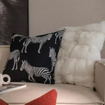 Black and white zebra throw pillow cover with fringes, adding a stylish touch to any living space.