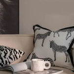 Black and white zebra throw pillow cover with fringes, adding a stylish touch to home decor.