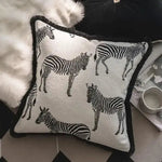 Black and white zebra throw pillow cover with fringes, featuring a stylish animal print design, perfect for home decor.