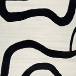 Close-up of the Black Current Flow Hand Tufted Area Rug, featuring a contemporary abstract design with bold black curves on a soft cream background. Perfect for adding a modern touch to large living room areas, this wool rug enhances both style and comfort.