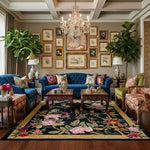 Luxurious living room with blue velvet sofa, floral rug, and decorative wall art.