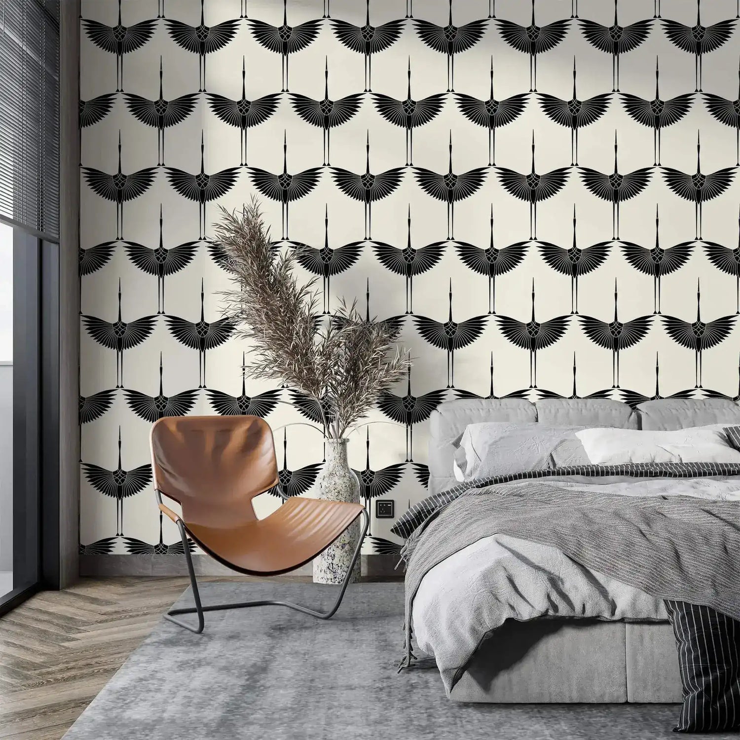 Black Heron Silhouette wallpaper of bold flying cranes on cream, styled with a leather chair