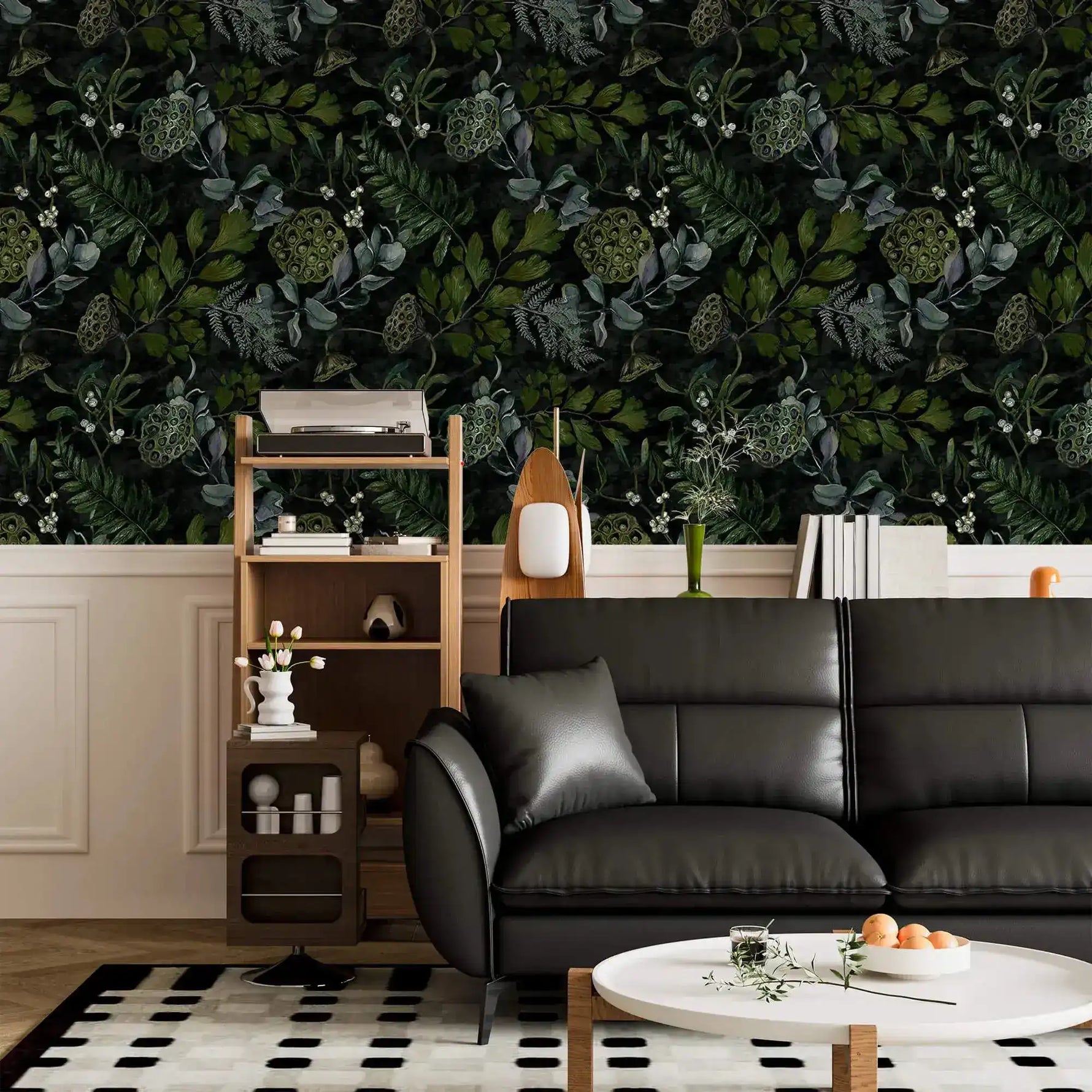 Black leather sofa and shelf against enigmatic leafy canopy wallpaper above white panelling