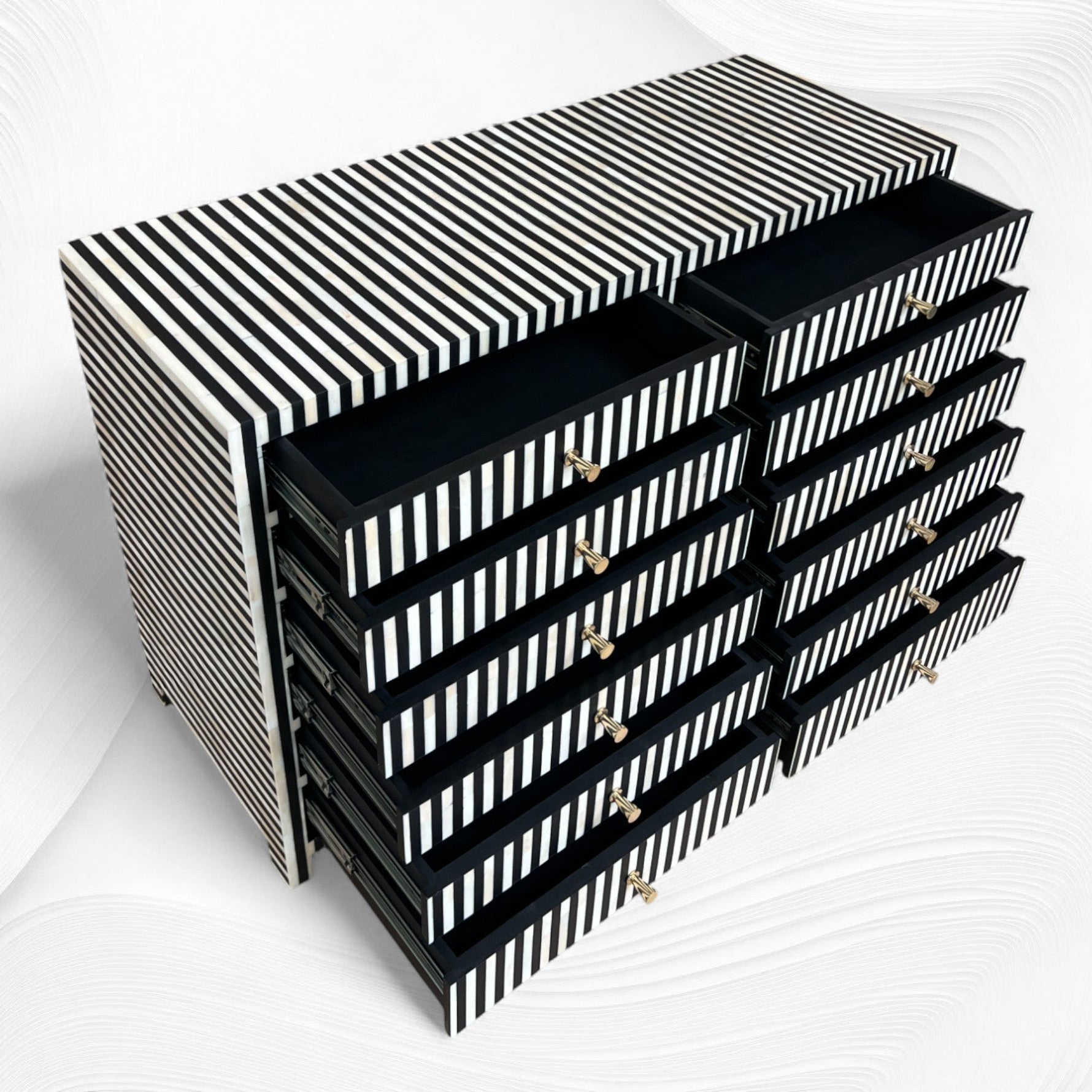 Black and white striped storage unit with multiple drawers on a white background